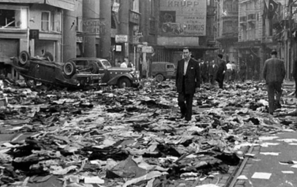Debris and an overturned car on an Istanbul street after the September 6-7, 1955 violence