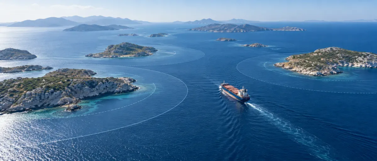 Cargo ship navigating between Aegean islands as maritime boundary arcs illustrate Greece’s 12-nautical-mile territorial-sea debate