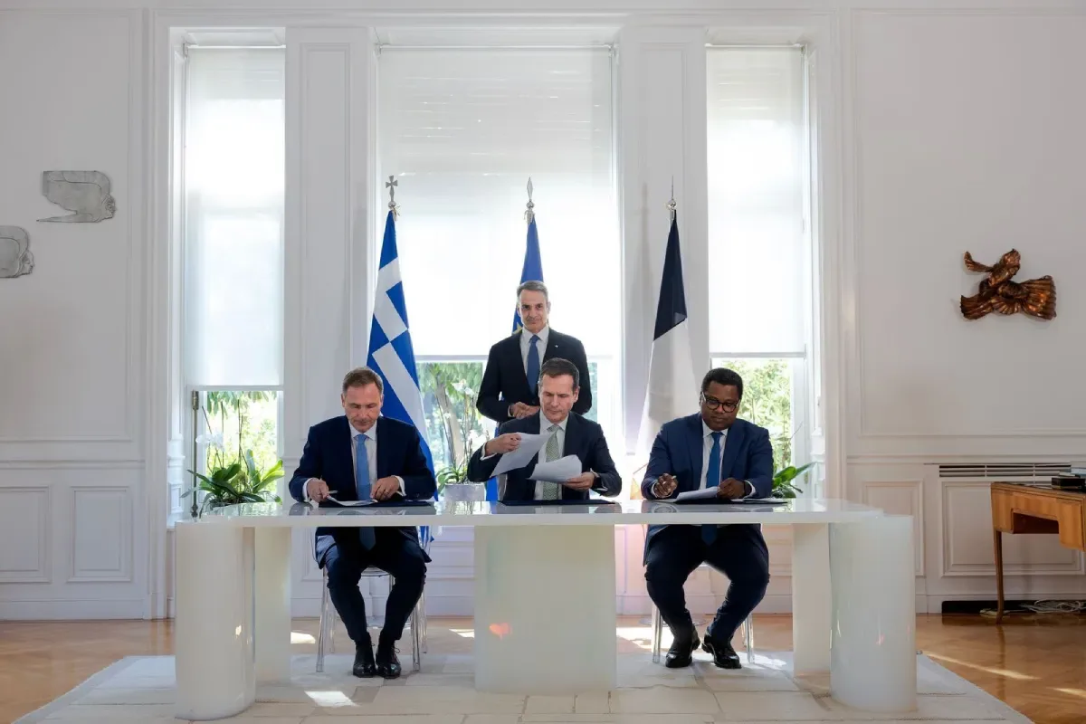 Officials sign the agreement bringing Meridiam into Great Sea Interconnector as majority shareholder in Athens