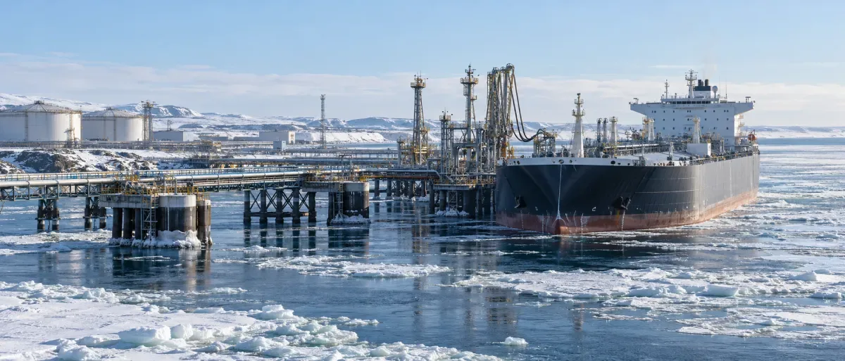 Ice-class oil tanker at an Arctic loading terminal surrounded by sea ice