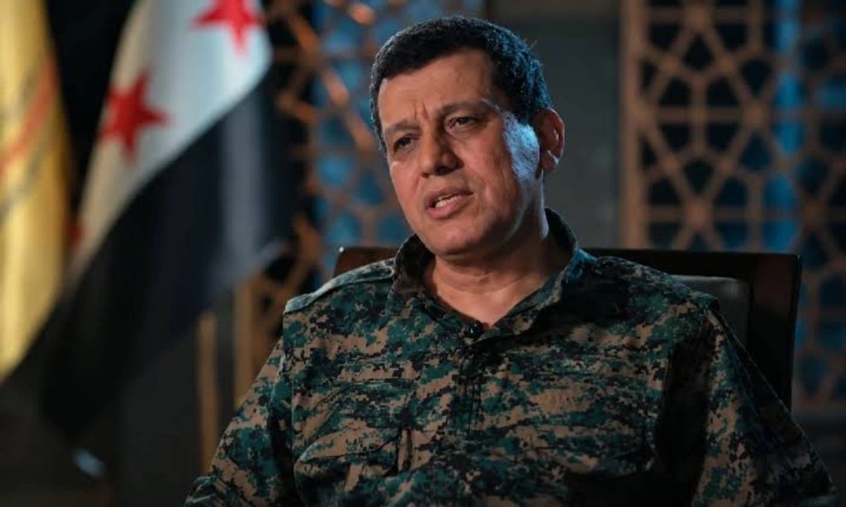 SDF commander speaking during an interview in military uniform